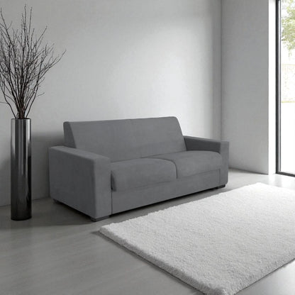 Il divano letto trasformabile in tessuto grigio con materasso integrato. Design moderno, materasso confortevole 140x190 cm e tessuto resistente. Perfetto per ogni ambiente.