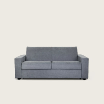 Il divano letto trasformabile in tessuto grigio con materasso integrato. Design moderno, materasso confortevole 140x190 cm e tessuto resistente. Perfetto per ogni ambiente.