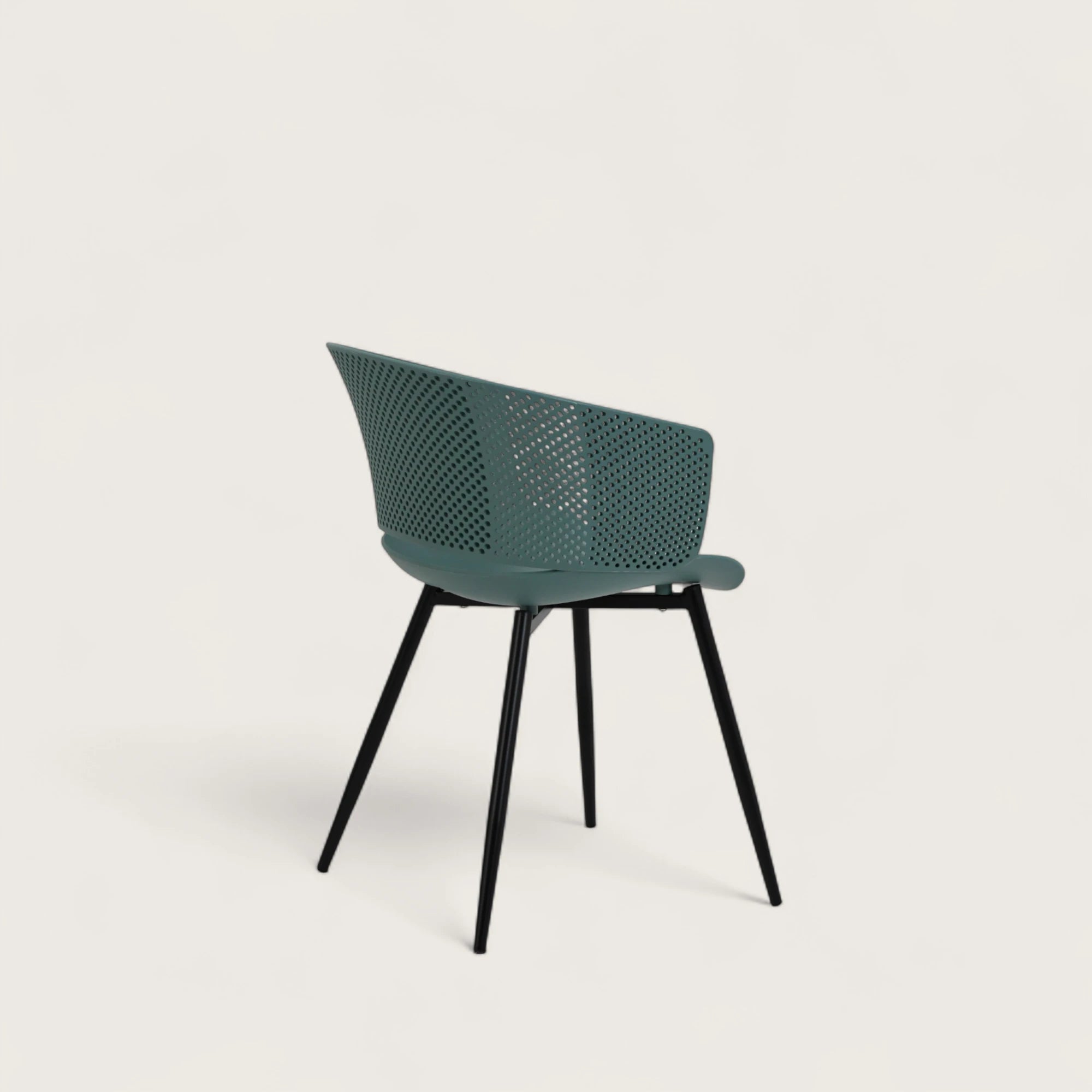 Sedia con scocca in polipropilene colore petrolio, schienale avvolgente  e gambe in metallo nero opaco, ideale per sale da pranzo, cucine e spazi contract.