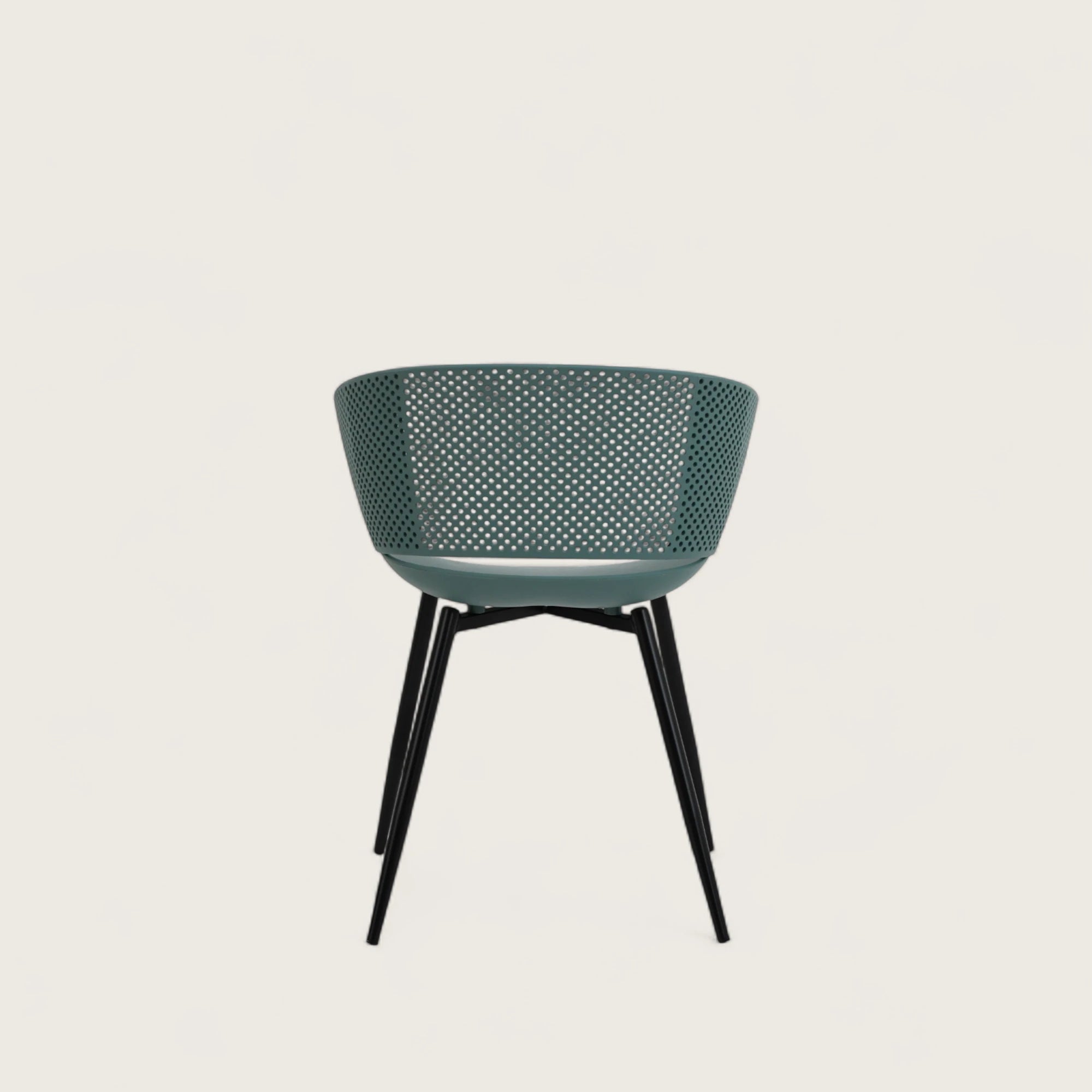 Sedia con scocca in polipropilene colore petrolio, schienale avvolgente  e gambe in metallo nero opaco, ideale per sale da pranzo, cucine e spazi contract.