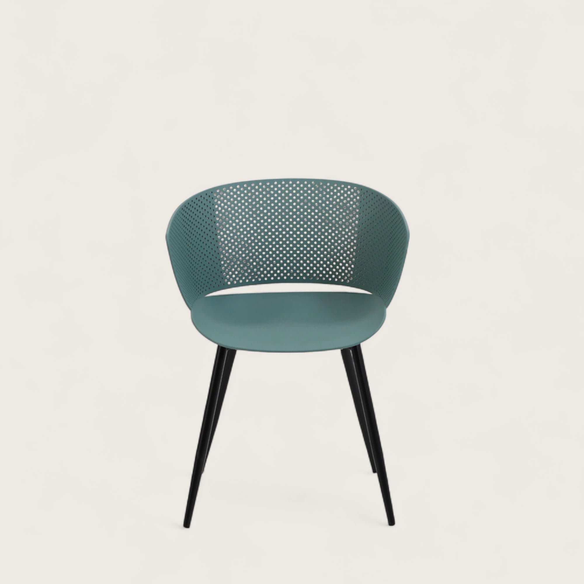 Sedia con scocca in polipropilene colore petrolio, schienale avvolgente  e gambe in metallo nero opaco, ideale per sale da pranzo, cucine e spazi contract.